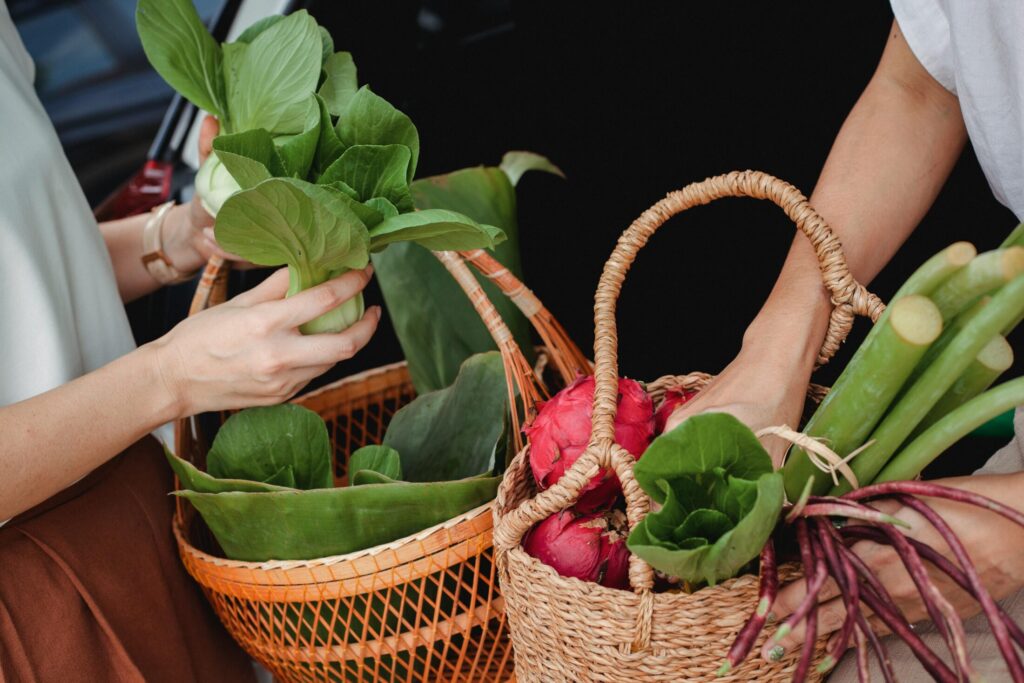 fresh green vegetables on woven basket