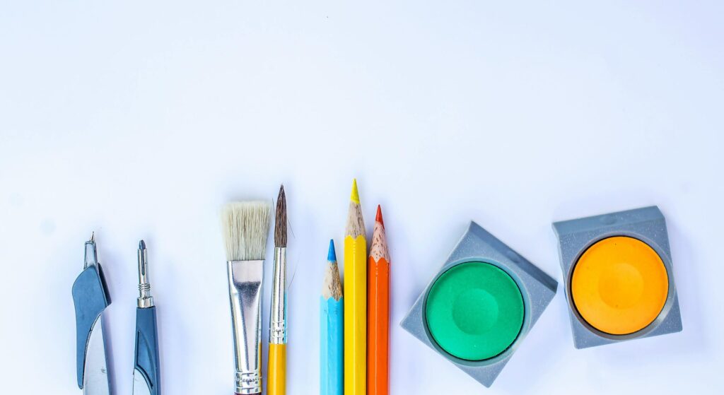a bunch of coloring materials on a white table
