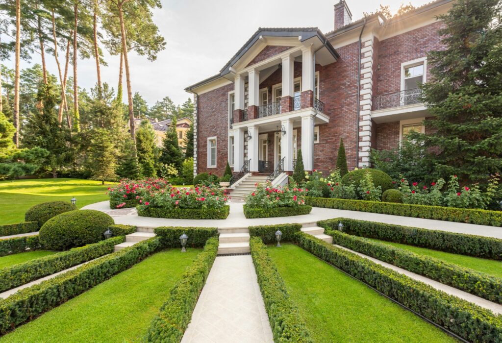 historic house exterior near plants and pathways in yard