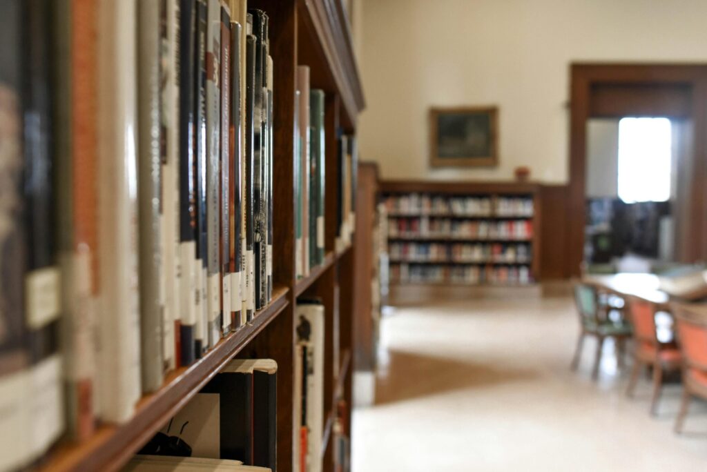 a selective focus photography of bookshef with books
